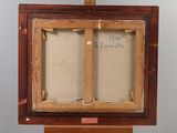 an old wooden easel with a painting on it with writing on it