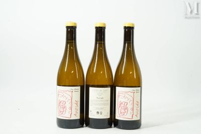 three bottles of wine sitting next to each other on a table