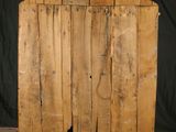 an image of a wooden cabinet with a door open on a black background