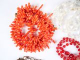 many different types of bracelets on a white surface