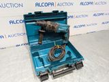 an electric drill in a blue case with a cord in it