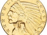 a close up of a gold coin with an indian head on it