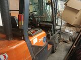 a forklift truck with a box on the back of it