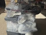 a large pile of items sitting on a pallet in a warehouse