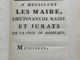 an old book with a black and white image of a man ' s face