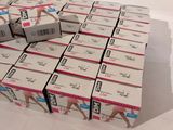 boxes of cigarettes stacked on top of each other on a white surface