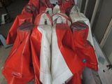 a pile of red and white jackets on the ground