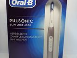 oral b dual sonic electric toothbrush in a box