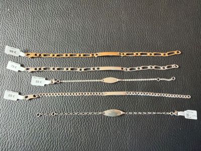 a group of five bracelets sitting on top of a table