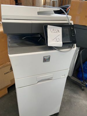 a printer that is sitting on top of a cabinet