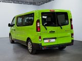 a green van that is parked inside of a building