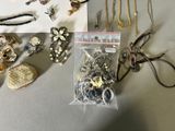 many different types of jewelry on display on the table