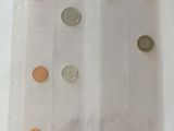 a lot of coins that are in a clear bag