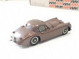 a toy car sitting on a table next to a box