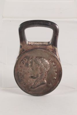 an image of a kettle weight with a coin on it