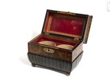 a small wooden box with two cups inside of it