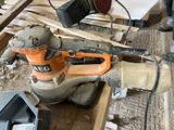 a sander that is sitting on top of a piece of wood