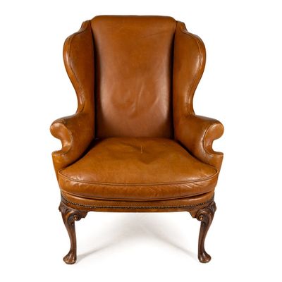 une image d'une chaise en cuir marron sur fond blanc