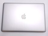 an apple laptop sitting on a table with a white background