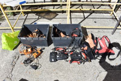 many pairs of shoes that are sitting on the ground