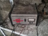 a small machine that is on the ground in the garage