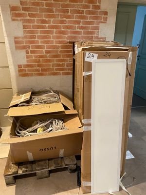 a refrigerator and a refrigerator freezer sitting in a room