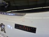 a close up of a car with a sticker on it