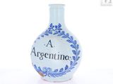 a blue and white vase with the word argentina on it