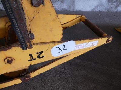 a close up of a yellow fork with a number on it