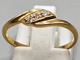 an image of a yellow gold ring with diamonds on it