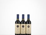 three bottles of wine sitting on top of a table