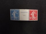 a close up of two stamps on a black surface