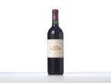 a bottle of wine that is sitting on a table