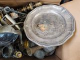 a cardboard box filled with a lot of old items