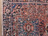 an antique persian rug with a blue and red design on it