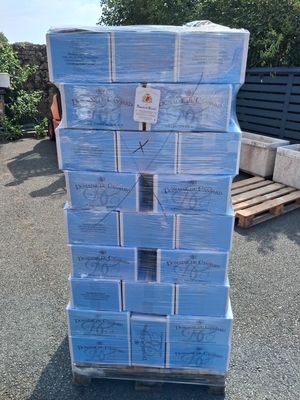 a large stack of boxes sitting on top of a pallet