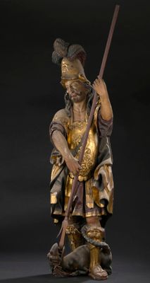 une image représentant la statue d'un homme muni d'une lance et portant un chapeau