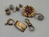two pairs of gold and diamond earrings and a clasp