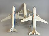 three model airplanes that are sitting on a table