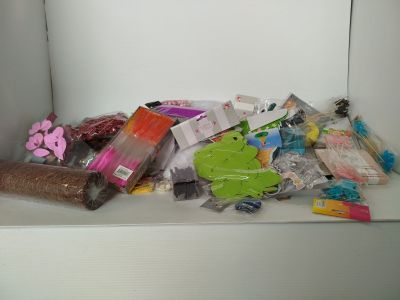a pile of assorted items sitting on a shelf