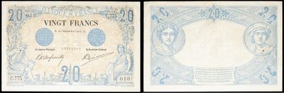 a close up of two different types of currency on a black background