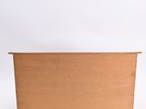 a wooden box sitting on top of a white surface