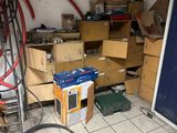an image of a room with a lot of clutter on the floor