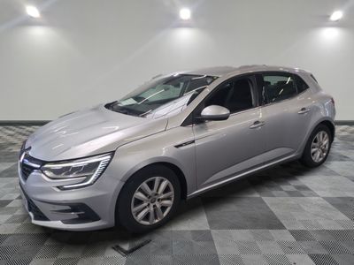 the silver car is parked in the garage on a checkered floor