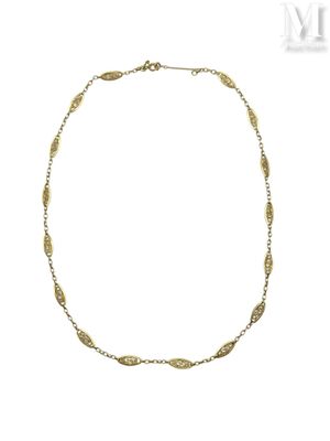 a gold chain necklace with a leaf design on a white background