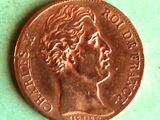 a close up of a penny on a green surface