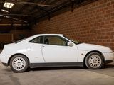 a white car that is parked in a garage