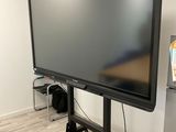 a flat screen tv on a stand in the corner of a room