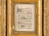 a gold frame with a picture of a man holding a sword