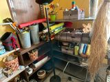 a room that has a lot of stuff on the shelves